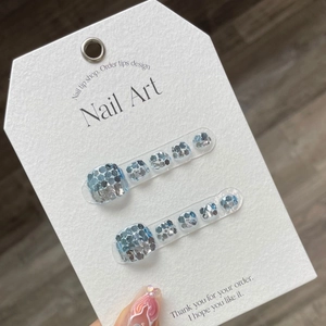 Handmade blue and silver sequin toenail patches with sparkling mosaic gradient on display card