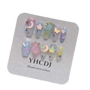 Dreamy candy-colored press-on nails with 3D stars moons and aurora crystal accents