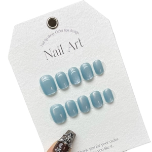 Short round blue cat eye press-on nails with 3D metal butterfly and star charms