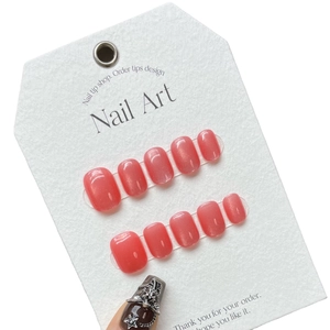 Handmade coral cat eye press-on nails set with metallic star and cross charms