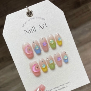 Star macaron handmade press-on nails with 3D moon charms and pink gradient finish