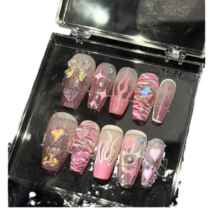 Y2K handmade press-on nails in pink and purple with 3D bows and glitter heart rhinestones