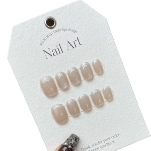 Champagne cat eye press-on nails set with rainbow laser shimmer on display card