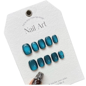 Handmade short dark blue cat eye press-on nails with colorful laser rainbow shimmer effect