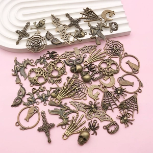Vintage bronze Halloween charms set featuring skulls bats and spider webs for DIY jewelry
