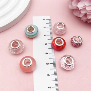 Mix of 7 pink and blue striped resin beads with rhinestones for DIY charm bracelets