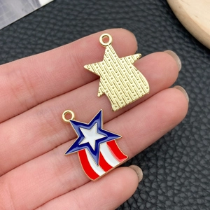 Detailed close-up of star-shaped enamel pendants with American flag patterns on black leather