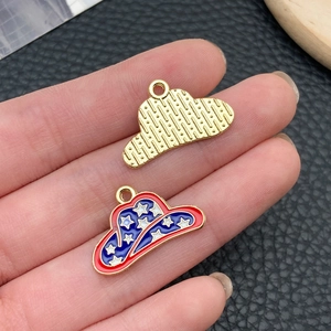 Macro detail of alloy cowboy hat charms with US flag star patterns for DIY jewelry making