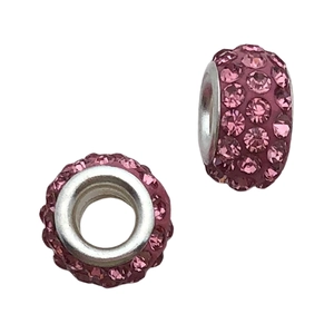 Detail of pink crystal pavé charms with large hole design for DIY jewelry making