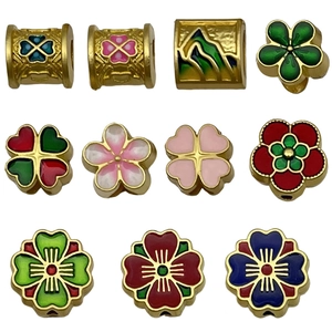 Golden enamel clover and cherry blossom charms for DIY jewelry making and necklaces