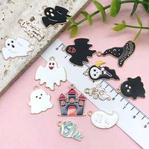Detailed macro view of 11 assorted Halloween alloy enamel charms with wizard hats and ghosts