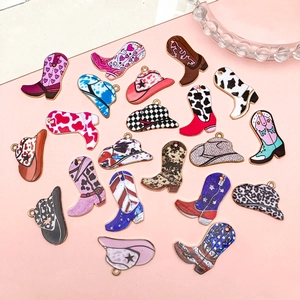 Detailed flat lay of colorful enamel cowboy hat and boot charms for DIY jewelry making