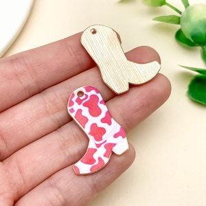 Detailed view of colorful enamel cowboy boot pendants with gold finish for DIY jewelry