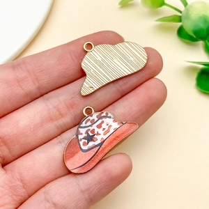 Detail view of red leopard print cowboy hat charm with star accent for DIY jewelry