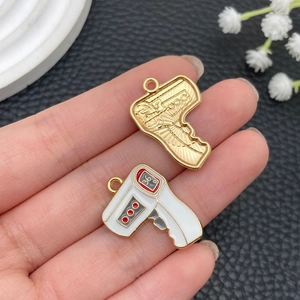 Macro detail of alloy infrared thermometer pendants for DIY jewelry and keychains