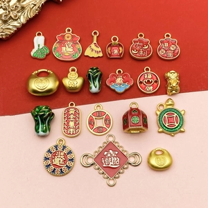 Detail of Chinese DIY charms with ingot and money bag shapes in colorful enamel finish