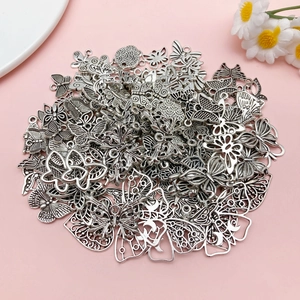 Macro detail of various antique silver alloy butterfly charms for DIY jewelry making
