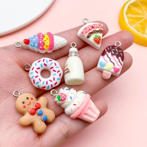 7-piece miniature resin dessert charms set including gingerbread man and milk bottle pendants