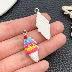 Macro view of colorful resin ice cream cone charms with silver metal loops