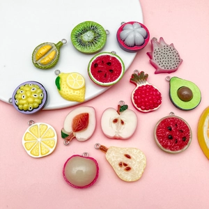 Detailed view of assorted resin fruit charms with metal rings for DIY jewelry making