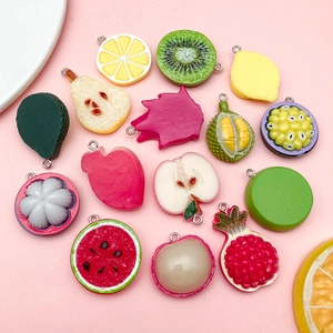 Assorted colorful resin fruit pendants including lemon and kiwi for DIY jewelry making