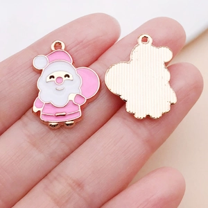 Detail of pink and white enamel Santa Claus charm with rose gold alloy plating
