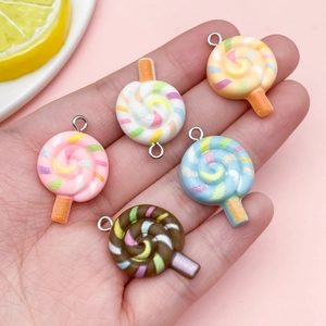 Handheld set of five colorful resin lollipop charms for DIY jewelry and bag accessories