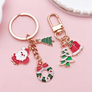 Christmas theme rose gold keychain with enamel Santa, tree and bell charms for gifts