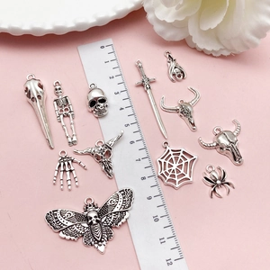 Retro silver alloy pendant set featuring gothic skeleton skull and spider web designs