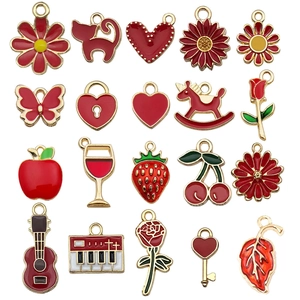 Red enamel and gold alloy charms set featuring flowers and fruits for DIY jewelry making