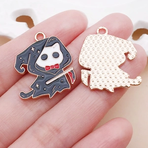 Detail of Halloween cat grim reaper enamel charms with scythe and golden metal plating
