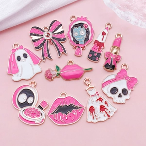 Macro detail of 10 rose pink gothic Halloween enamel alloy charms for DIY jewelry making