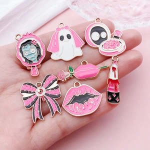 Pastel Goth Halloween ghost and bow alloy charms in pink and black for DIY jewelry making