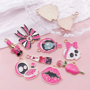 Pink gothic Halloween charms set featuring skulls with bows and enamel drip oil icons