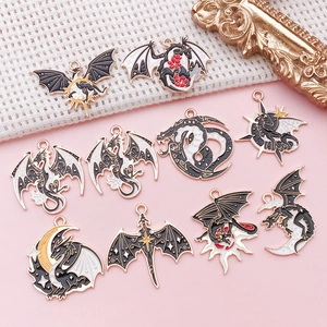 Detailed macro view of DIY alloy dragon charms with black enamel and gold plating