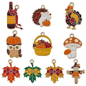Set of 10 autumn enamel charms featuring maple leaves, hedgehogs, and pumpkins for DIY jewelry