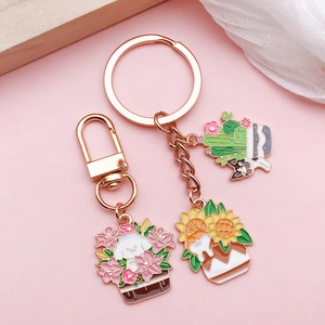 Charmants pendentifs émaillés chien et plante avec fermoirs mousquetons or rose
