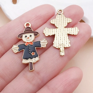 Macro view showing front and back of scarecrow alloy enamel pendants for DIY jewelry