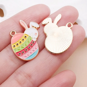 Detailed macro view of colorful enamel Easter bunny alloy pendants for DIY jewelry making