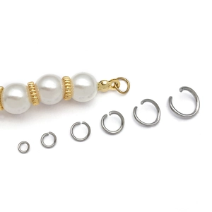 Detailed view of six sizes of silver stainless steel jump rings for DIY jewelry making
