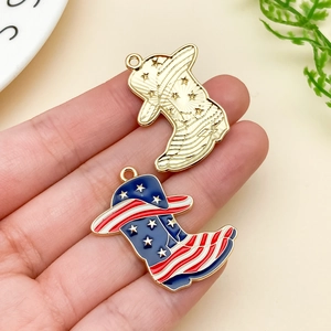 Detail of USA flag enamel cowboy boot charms and golden metal boot pendants for DIY jewelry