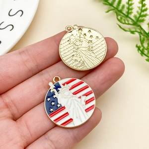 Detailed macro of Liberty Statue and American flag enamel charms for DIY jewelry making