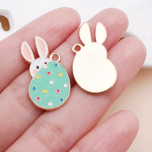 Detailed front and back view of Easter bunny and green dotted egg alloy pendant for DIY jewelry