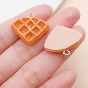 Macro view of 3D resin waffle pendants with realistic texture and silver metal rings