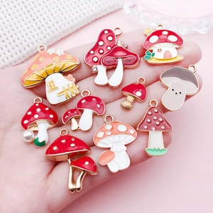 Macro shot of colorful enamel mushroom house charms for DIY jewelry and necklaces