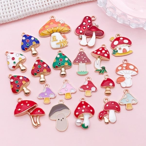 Detailed flat lay of colorful enamel mushroom alloy charms for DIY jewelry and necklaces