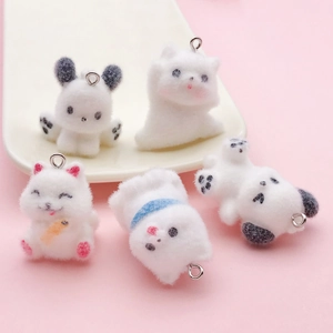 Five styles of cute white flocked puppy charms with metal rings on pink background