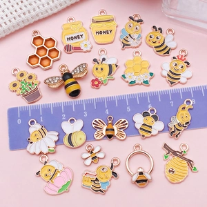 DIY bee and sunflower alloy pendants in yellow and gold finish for jewelry making