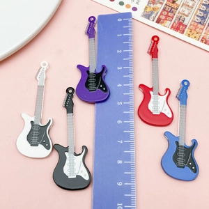 Close-up of 5cm acrylic guitar pendants in five colors with scale measurement