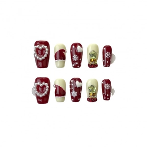 Set unghie finte natalizie bordeaux con fiocchi di neve e decorazioni a stella in 3D